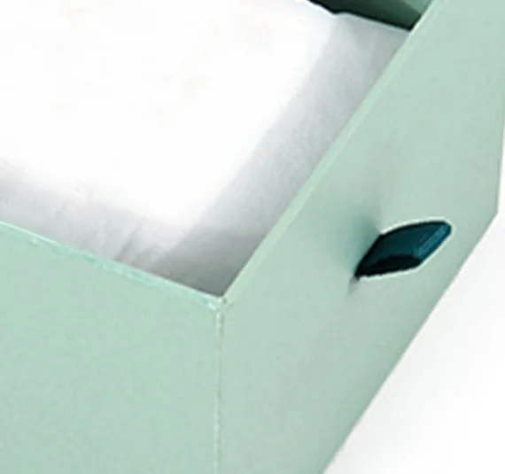 Drawer-style jewelry box with a ribbon pull